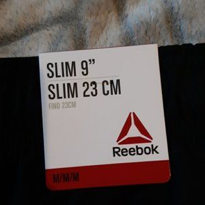 Reebok black shorts with pockets  and a pocket  sipper on the side